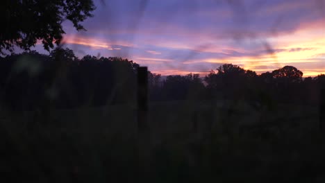 captivating panoramic footage moving left to right, capturing a dreamlike rural sunset