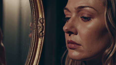 woman looking at herself in a mirror