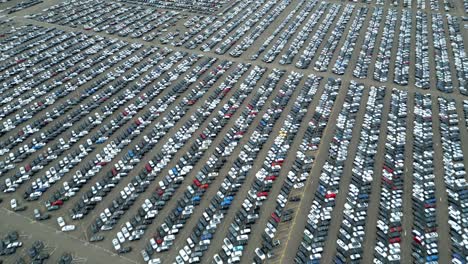 many cars on a parking lot from above, filmed with a drone in 4k