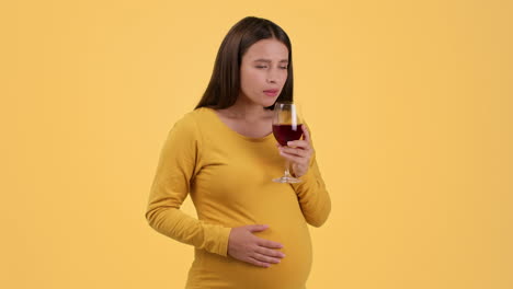 pregnant woman drinking wine