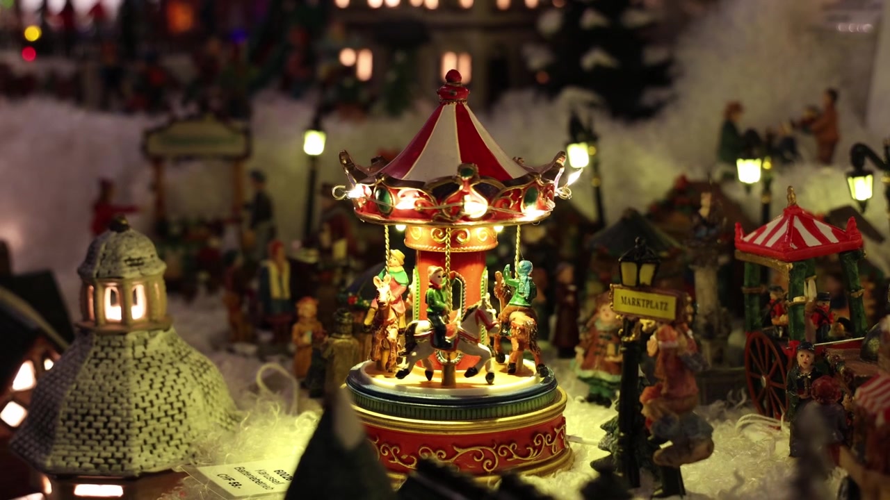 Spinning merry go round decor for sale in Christmas market, close up