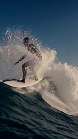 professional surfer skillfully riding a powerful ocean wave under a bright sun, executing dynamic maneuvers with precision and showcasing the thrill of extreme water sports