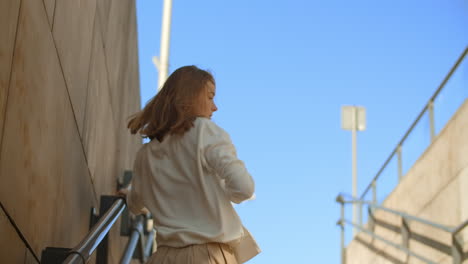 woman posing on city stairs