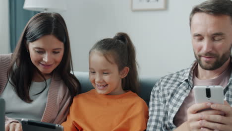 family using digital devices together