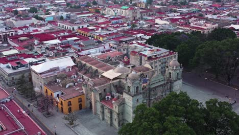 aerial view, oaxaca cathedral and historic center in city downtown, unesco world heritage, revealing drone shot