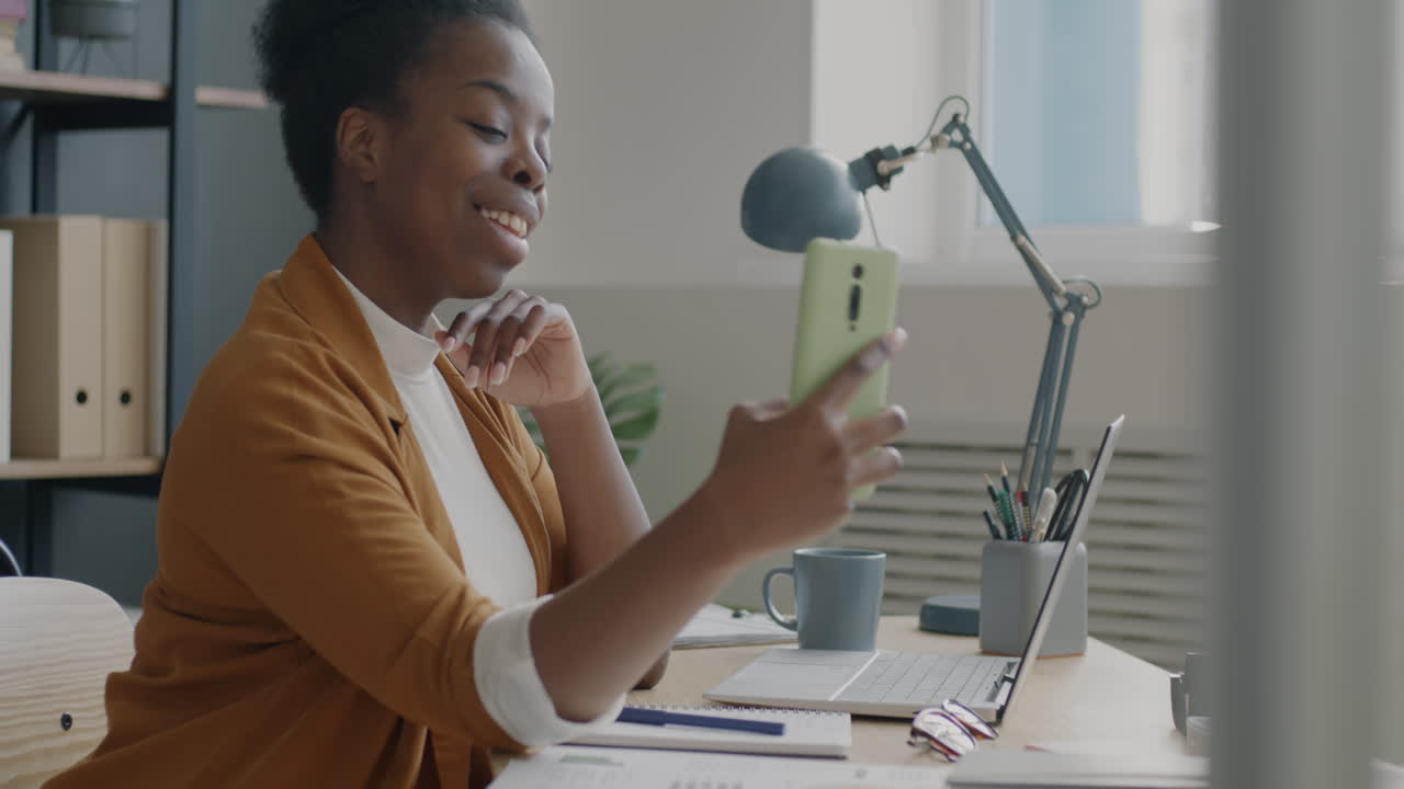 Woman on video call at office desk