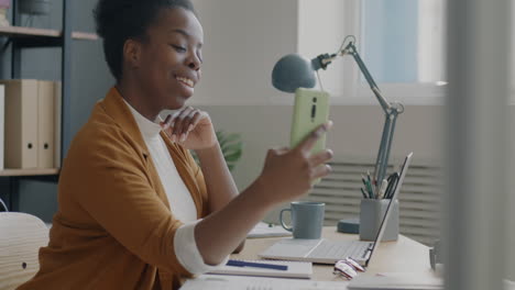 woman on video call at office desk