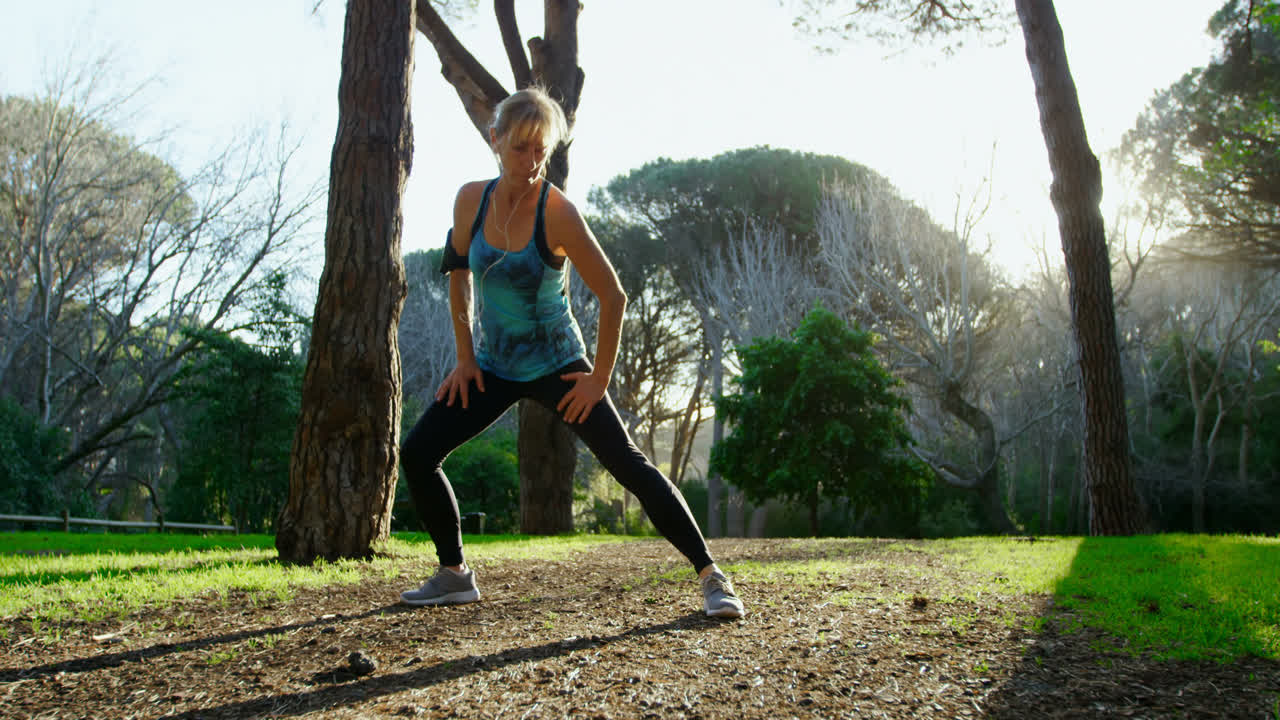 Senior woman exercising in the park 4k