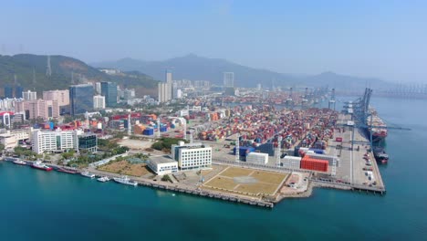 Shenzhen-commercial-Port-terminal-with-docked-Ships-and-Container-yard,-Aerial-view