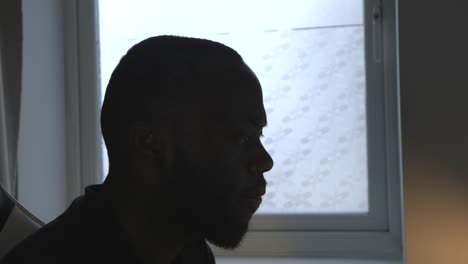 Close-Up-Of-Black-Male-Listening-To-Music-And-Doing-Work-In-Room