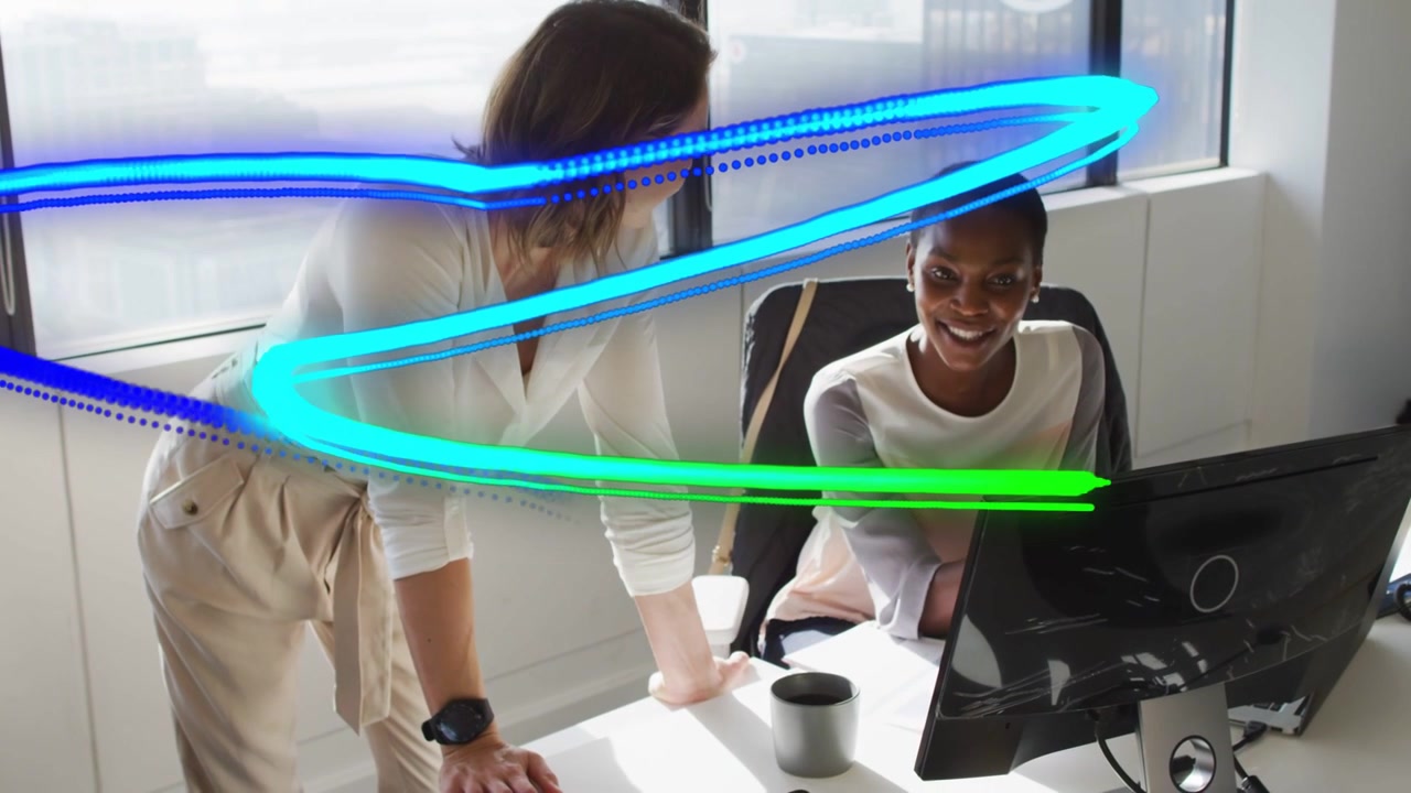 Standing woman pointing at monitor, sparking neon arcs tracing hand during business training