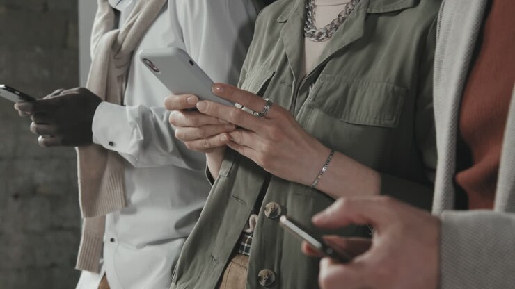 Unrecognizable People Using Smartphones