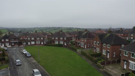 Aerial-view,-footage-of-a-council-housing-estate-in-Kidsgrove-Stoke-on-Trent,-flats,-homes-for-the-ever-growing-population,-immigration-and-poorer-areas-of-the-west-midlands,-cheap,-affordable-housing