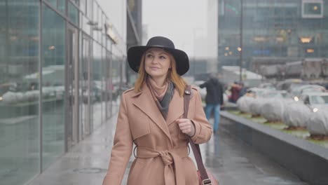 woman walking in the city on a rainy day