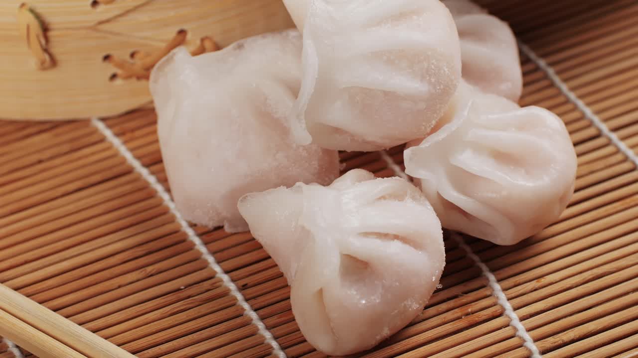 Various of frozen dim sum close-up macro. Food to take away. Chinese dessert food. Dimsum with shrimps, fish and meat. Dish in a cafe. Delivery