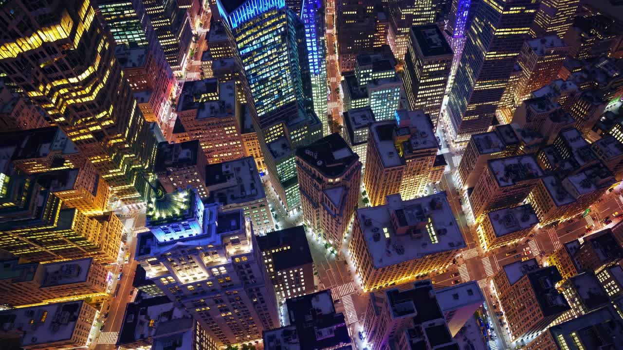 Aerial view of vibrant city skyline at night, showcasing illuminated skyscrapers and bustling streets, capturing the dynamic urban atmosphere in motion