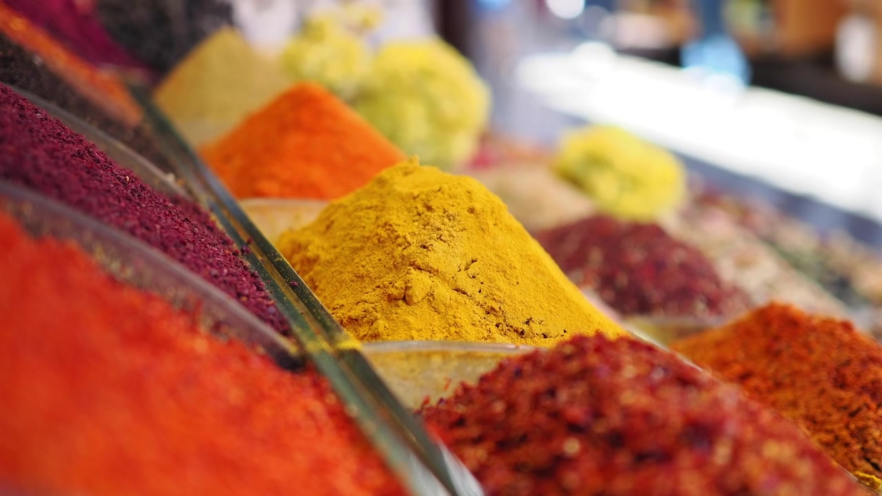 Vibrant Piles of Colorful Spices at a Traditional Market