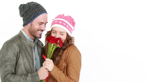 man offering flowers to his girlfriend