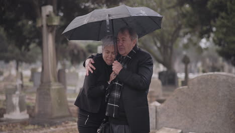 support, death or old couple in cemetery