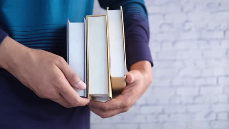 student holding books