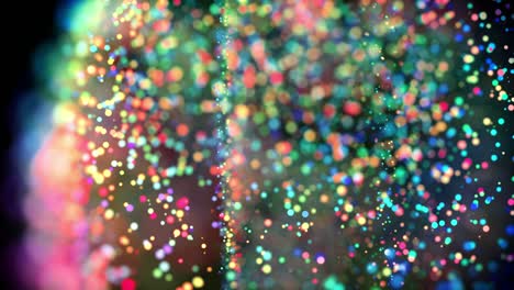 multicolored particles in liquid float and glisten. 4k 3d advection background with glittering particles, depth of field and bokeh isolated on black. luma matte to cut out particles. 10