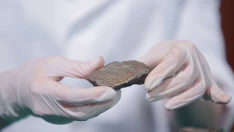 scientist examining a rock sample