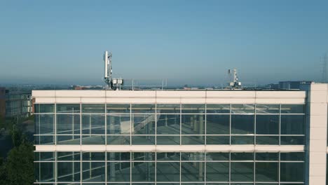 An Office Building With Transmission Antenna On The Rooftop Deserted Due To Coronavirus Crisis In Dublin, Ireland - aerial drone