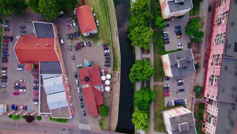 Drone-footage-of-a-city-with-curved-river