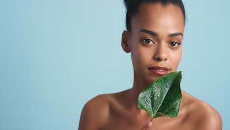 Beauty-studio-portrait,-black-woman-leaf-natural