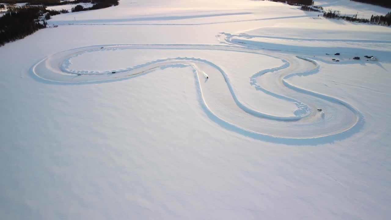 Whole Race track on a Frozen Lake in Finland during golden hour – Aerial Winter Landscape high altitude