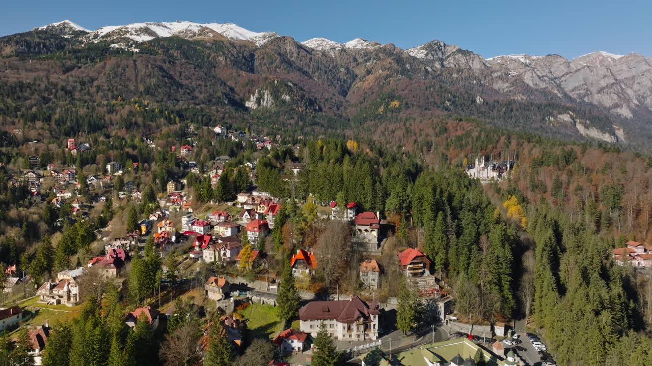 Aerial drone view of Sinaia, Romania, in the Bucegi Mountains, surrounded by ski trails