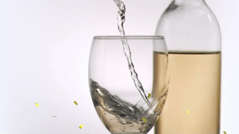 Animation-of-confetti-falling-over-glass-of-wine-on-white-background