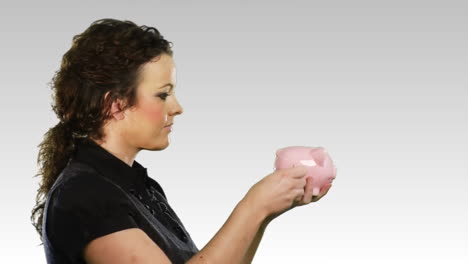 woman with a piggy bank