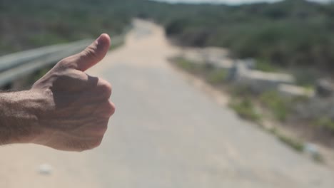 closeup of hand hitchhiking