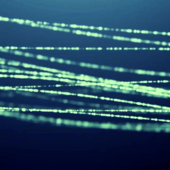 Abstract Glowing Green Lines Flowing on Dark Blue Background