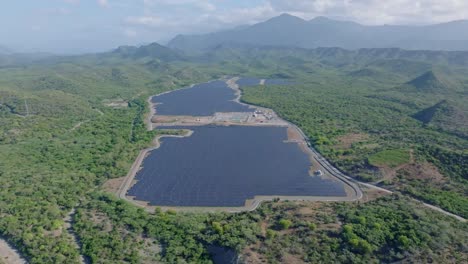 aerial view of solar power plant with vegetation in bani, dominican republic