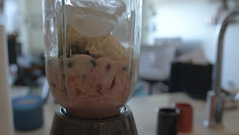 close up slow motion of a blender making a smoothie