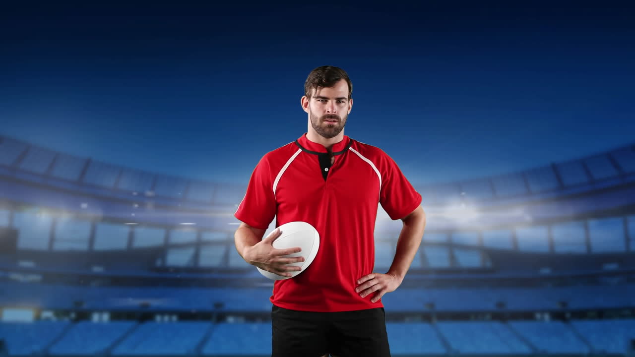 프로 럭비 선수 가 경기장 앞 에 서 있다