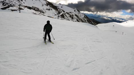 following a tourist skiing at remarkables ski resort in queenstown, new zealand