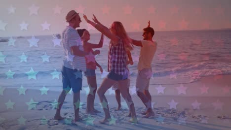 animation of flag of united states of america over diverse friends jumping and high fiving on beach