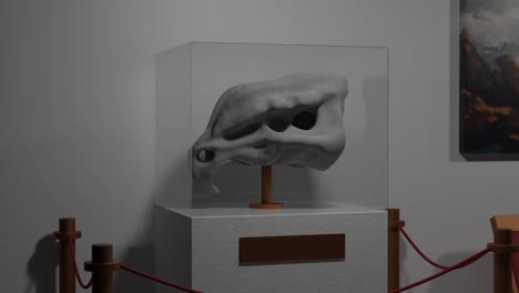 a white sculpture on display in a museum