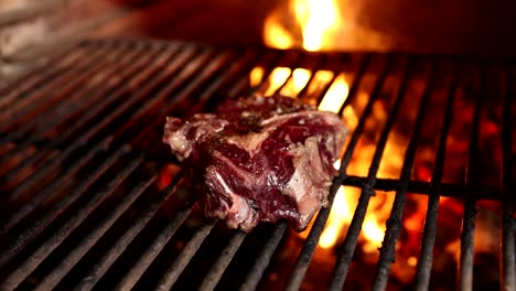 steak grilling on charcoal grill