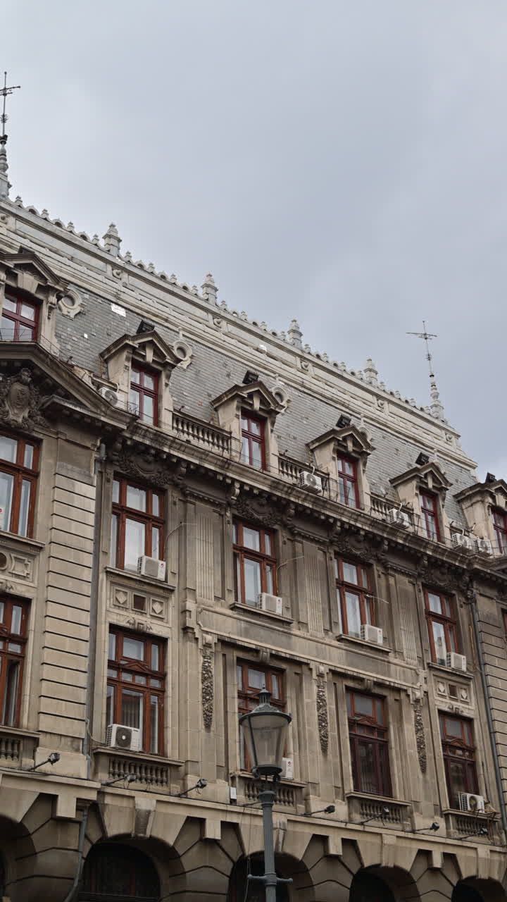 The facade of an old building in the Old Town of Bucharest, Romania. Vertical
