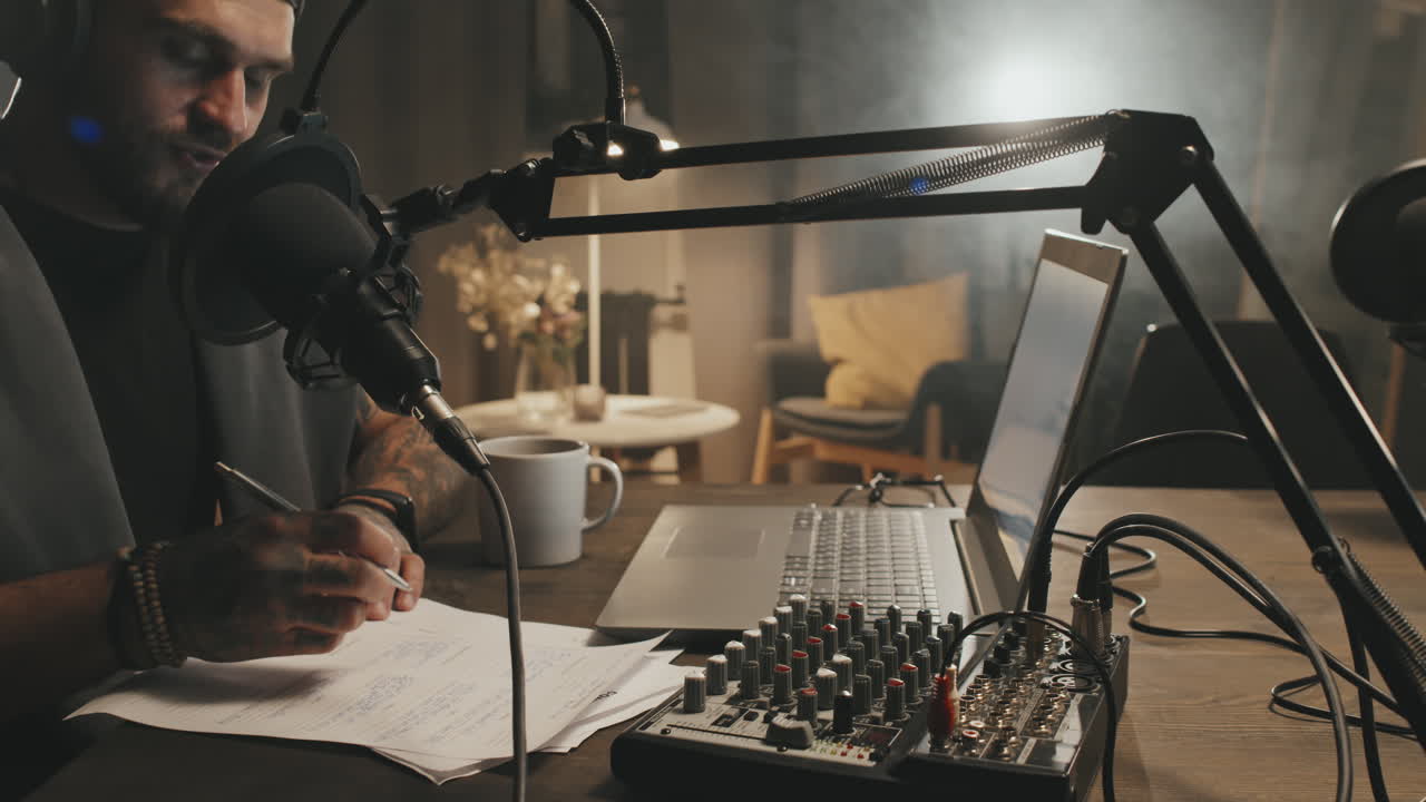 Male Podcast Host Recording Show at Home