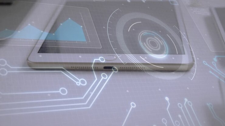 Tablet powering, HUD spinning, circuits extending, graph appearing above paper for analysis