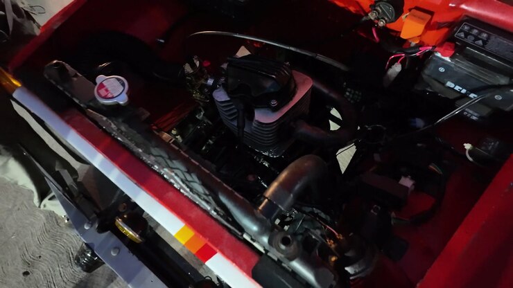 Close-up of custom car motor built at home, highlighting craftsmanship