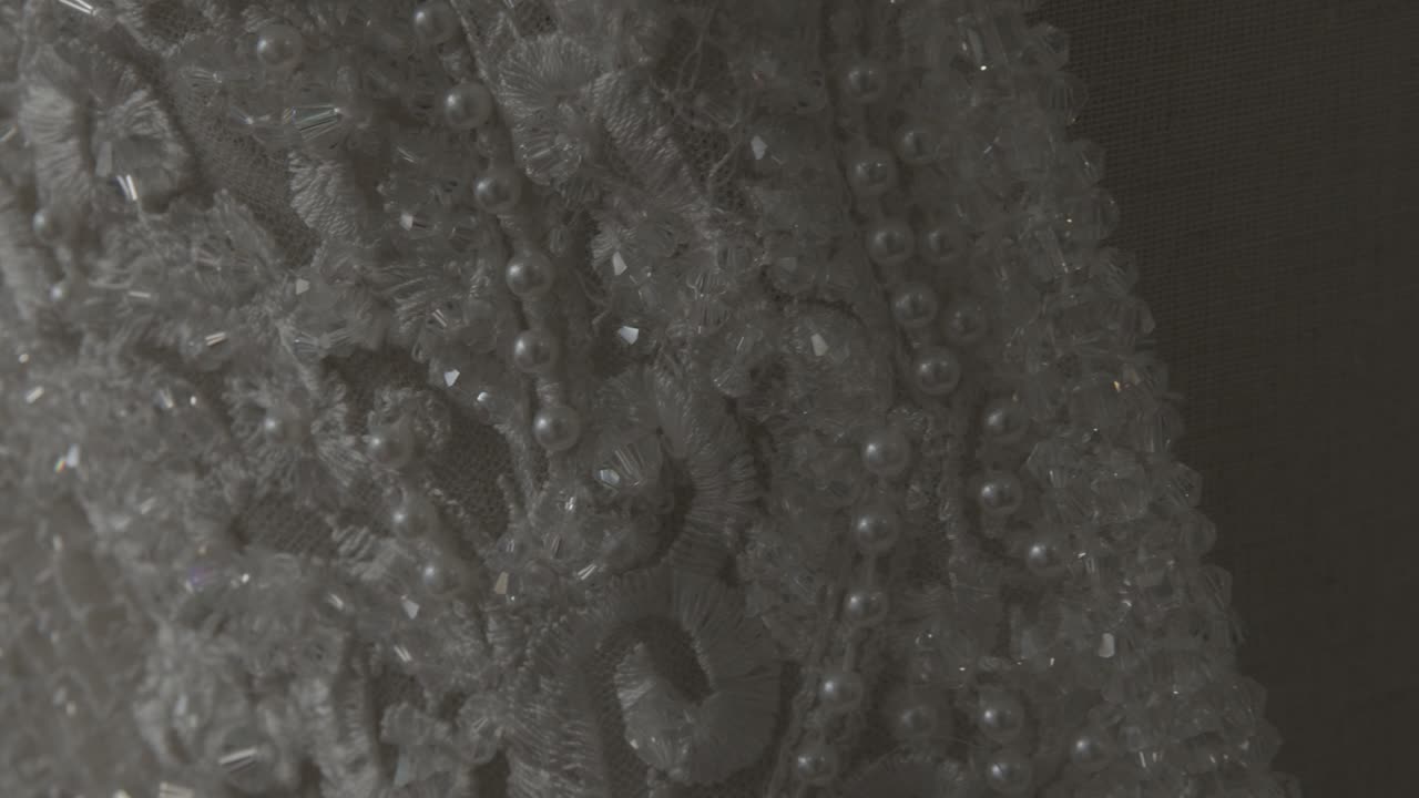 a close-up look at a wedding dress in a wedding salon