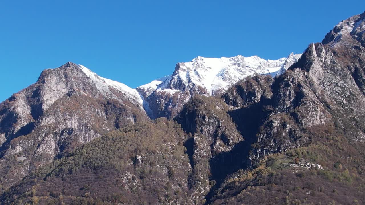 Stunning aerial view of the snow-capped Alps in Italy on a clear day
