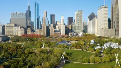 low aerial shot above millennium park on beautiful autumn day