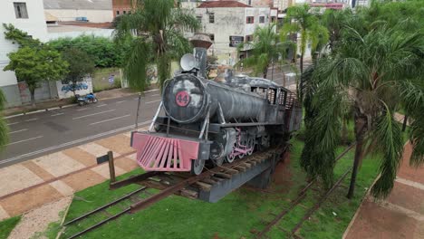 low aerial orbits fumaca train locomotive monument, campo grande brazil